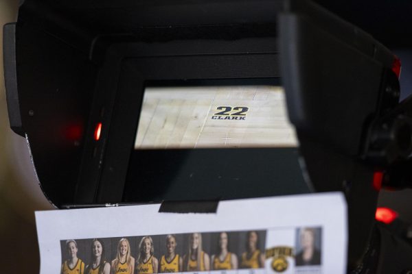 A logo for Iowa guard Caitlin Clark’s record-breaking shot is seen through a camera during a basketball game between No. 4 Iowa and Illinois inside a sold-out Carver-Hawkeye Arena in Iowa City, Iowa, on Sunday, Feb. 25, 2024. The Hawkeyes defeated the Fighting Illini, 101-85.