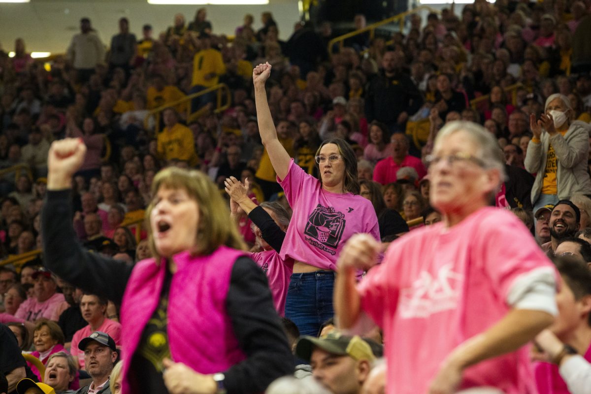 Fans cheer during a basketball game between No. 4 Iowa and Illinois inside a sold-out Carver-Hawkeye Arena in Iowa City, Iowa, on Sunday, Feb. 25, 2024. The Hawkeyes defeated the Fighting Illini, 101-85.