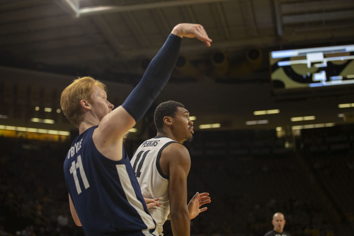 Iowa guard Tony Perkins watches as Penn State forward Leo O’Boyle hits a three-pointer during a men’s basketball game between Iowa and Penn State at Carver-Hawkeye Arena on Tuesday, Feb. 27, 2024. The Hawkeyes defeated the Nittany Lions, 90-81.