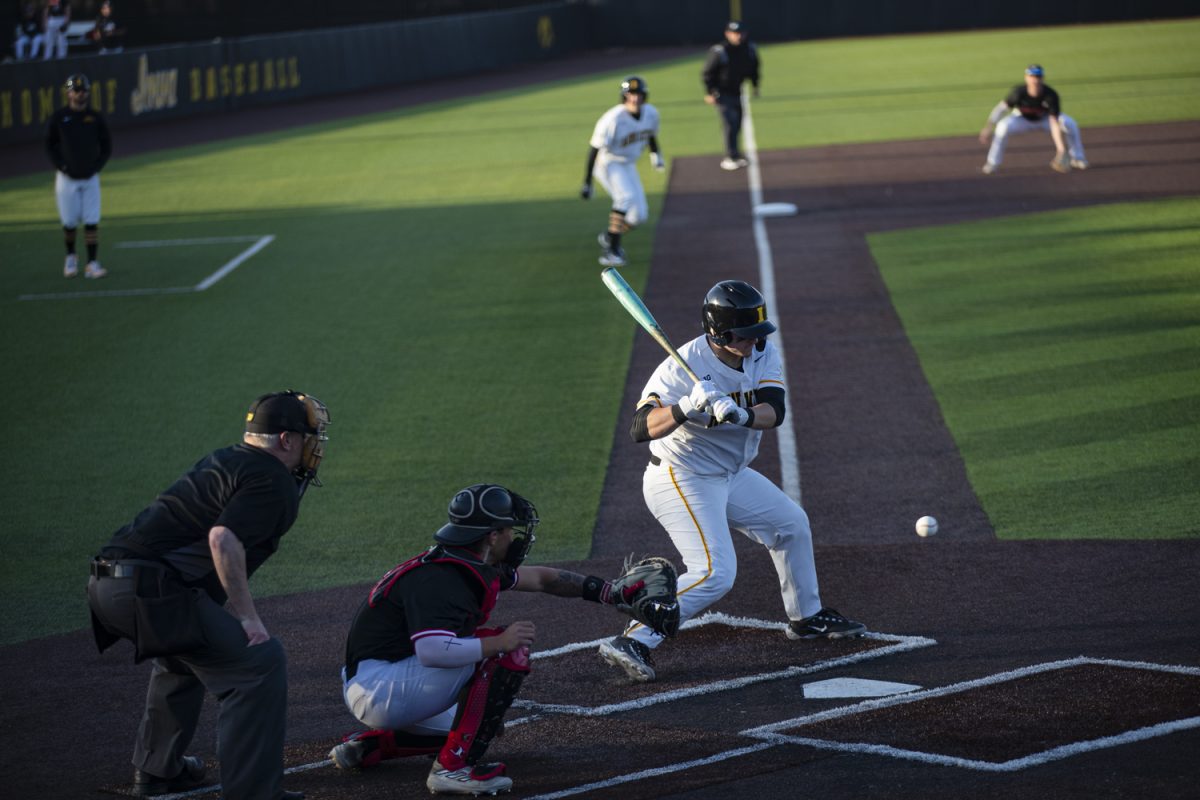 Iowa catcher Davis Cop watches the ball during a baseball game between No. 18 Iowa and Northern Illinois at Duane Banks Field on Tuesday, Feb. 27, 2024. The Hawkeyes defeated the Huskies, 14-6.