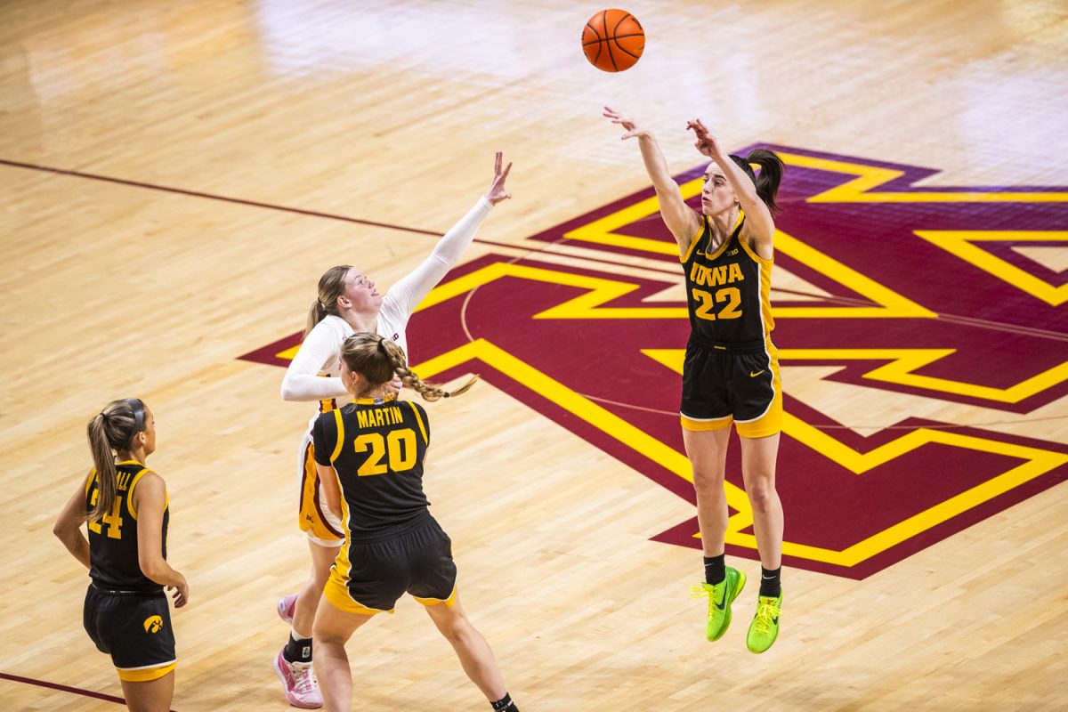 Iowa guard Caitlin Clark shoots a three-pointer during a women’s basketball game between Iowa and Minnesota at Williams Arena in Minneapolis, Minnesota, on Wednesday, Feb. 28, 2024.