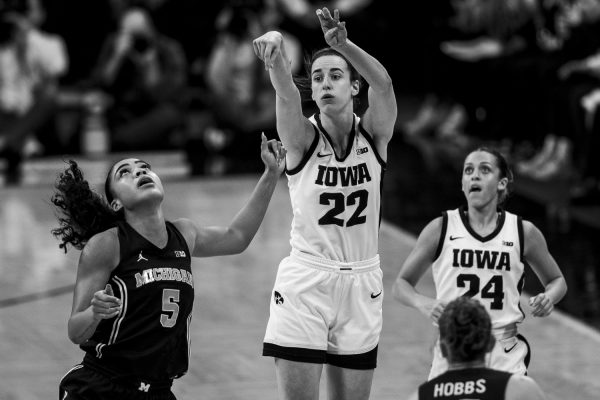 Iowa guard Caitlin Clark goes up for the record-breaking shot during a women’s basketball game between No. 2 Iowa and Michigan at Carver-Hawkeye Arena on Thursday, Feb. 15, 2024. The Hawkeyes defeated the Wolverines, 106-89.