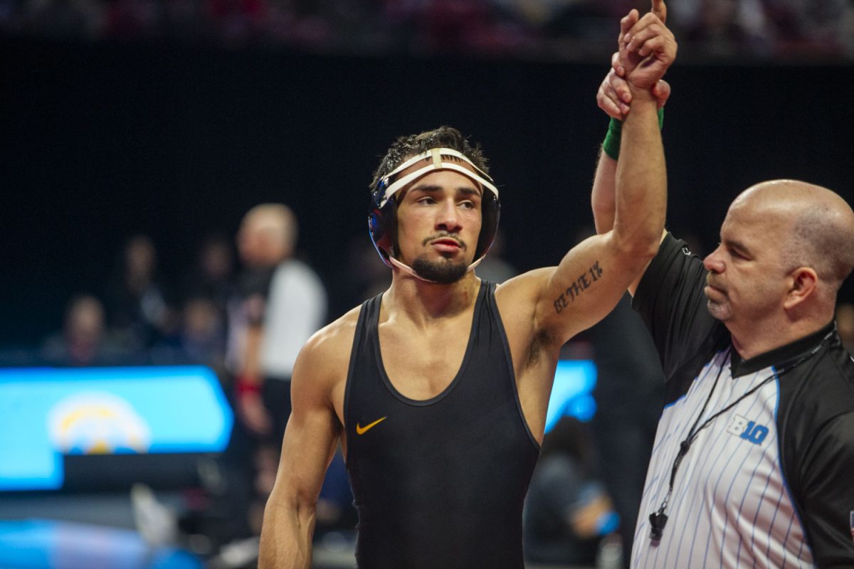 No. 3 141-pound Iowa’s Real Woods defeats No. 6 Illinois Danny Pucino during session one of the Big Ten Wrestling Championships at the Xfinity Center in College Park, MD, on Saturday, March 9, 2024. Woods defeated Pucino by decision 13-9.