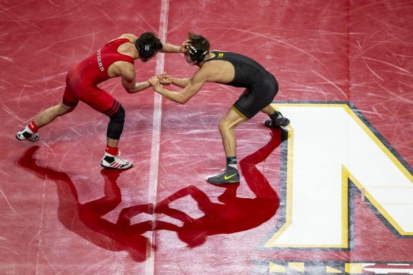 No. 2 125-pound Iowa’s Drake Ayala  wrestles No. 9 Rutgers’ Dean Peterson during session three of the Big Ten Wrestling Championships at the Xfinity Center in College Park, MD, on Saturday, March 9, 2024. 