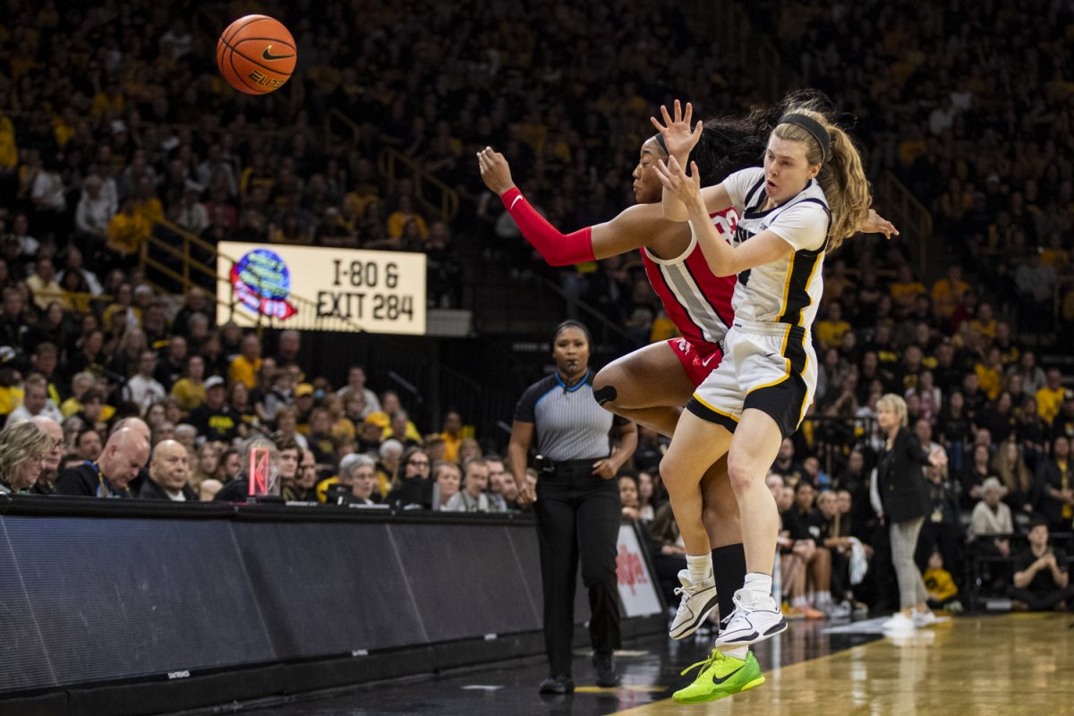 Ohio State forward Cotie McMahon and Iowa guard Molly Davis battle for the ball during a basketball game between No. 6 Iowa and No. 2 Ohio State at Carver-Hawkeye Arena on Sunday, March 3, 2024. The Hawkeyes defeated the Buckeyes, 93-83.