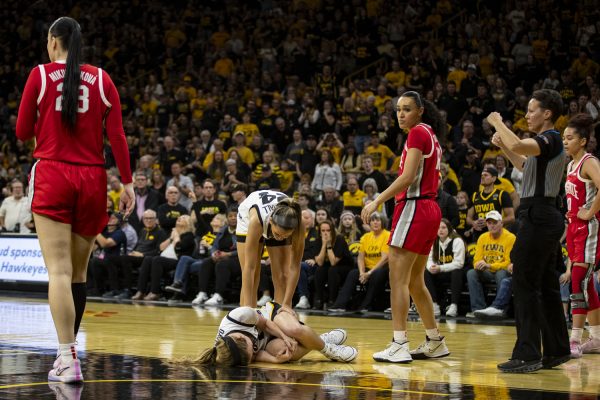 Iowa guard Molly Davis lays on the ground after getting injured during a basketball game between No. 6 Iowa and No. 2 Ohio State at Carver-Hawkeye Arena on Sunday, March 3, 2024. The Hawkeyes defeated the Buckeyes, 93-83.