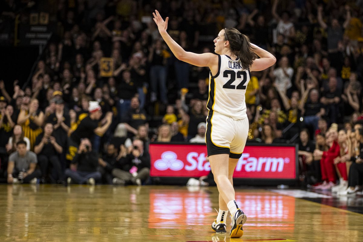 Iowa guard Caitlin Clark gestures toward the crowd during a basketball game between No. 6 Iowa and No. 2 Ohio State at Carver-Hawkeye Arena on Sunday, March 3, 2024. The Hawkeyes defeated the Buckeyes, 93-83.