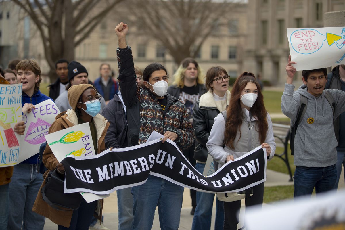 COGS members react to a speaker during a COGS Protest on the Pentacrest on Tuesday, March 5, 2024.
