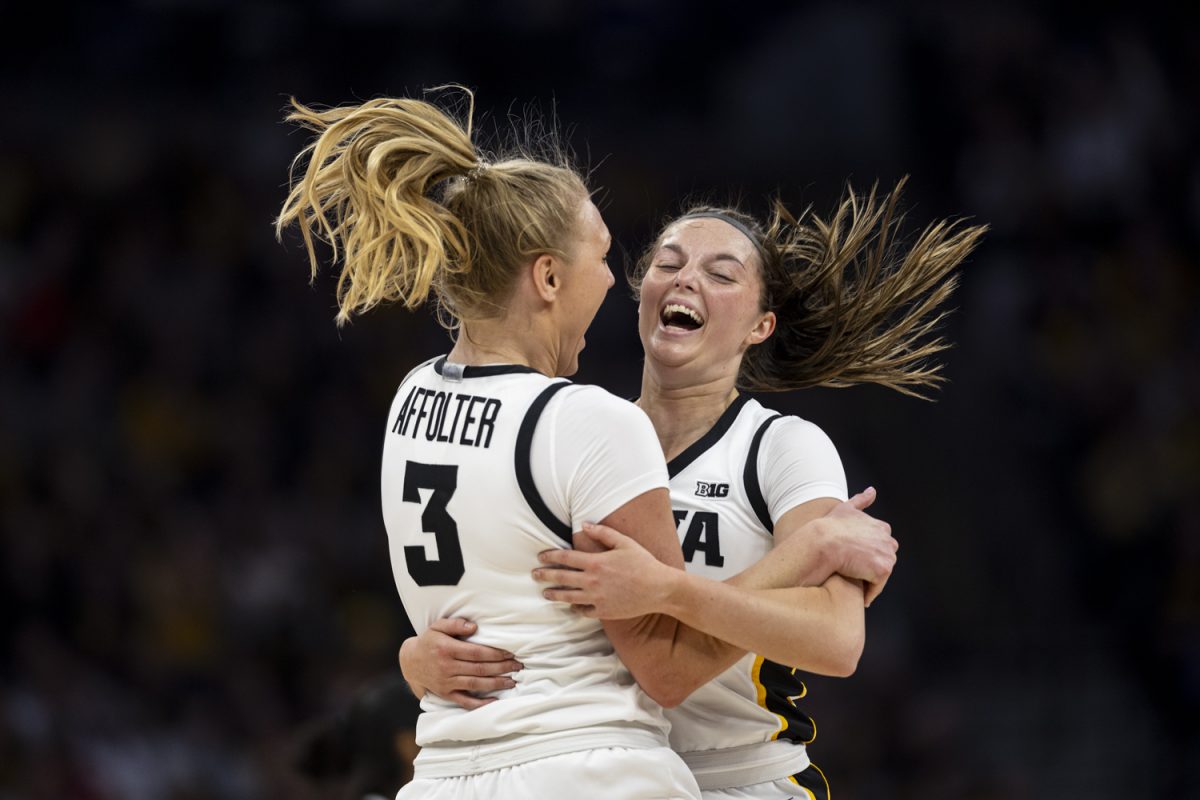 Iowa guard Sydney Affolter and guard Taylor McCabe celebrate during a basketball game between No. 2 Iowa and No. 7 Penn State at the TIAA Big Ten Women’s Basketball Tournament at Target Center in Minneapolis, Minn., on Friday, March 8, 2024. The Hawkeyes defeated the Nittany Lions, 95-62.