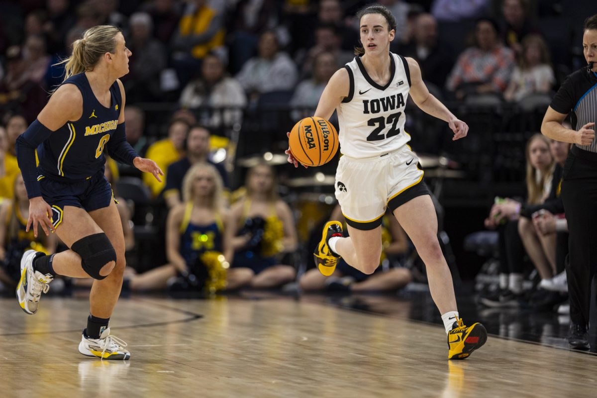 Iowa guard Caitlin Clark dribbles the ball during a basketball game between No. 2 Iowa and No. 6 Michigan at the TIAA Big Ten Women’s Basketball Tournament at Target Center in Minneapolis, Minn., on Saturday, March 9, 2024. The Hawkeyes defeated the Wolverines, 95-68. 