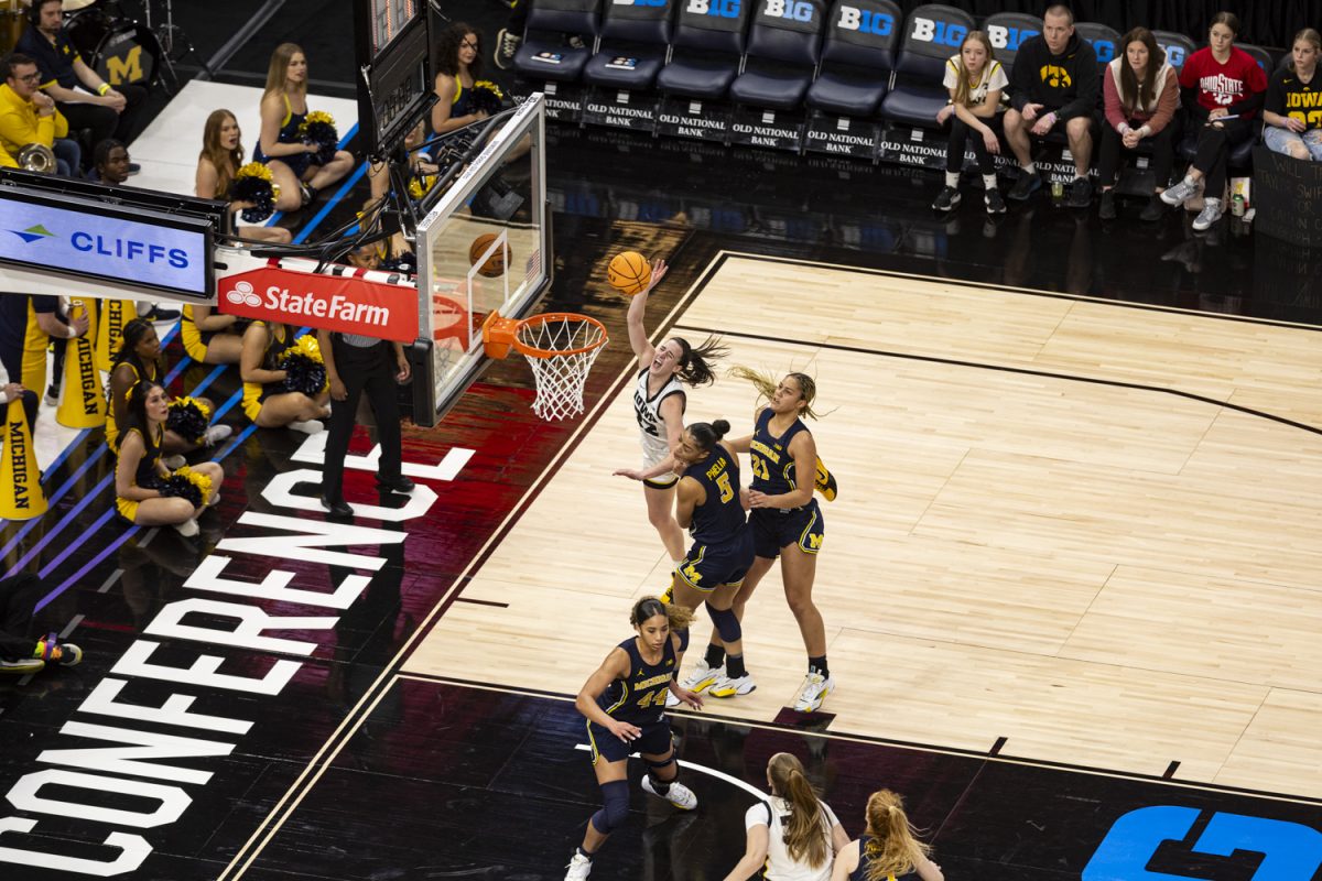 Iowa guard Caitlin Clark goes in for a layup during a basketball game between No. 2 Iowa and No. 6 Michigan at the TIAA Big Ten Women’s Basketball Tournament at Target Center in Minneapolis, Minn., on Saturday, March 9, 2024. The Hawkeyes defeated the Wolverines, 95-68.