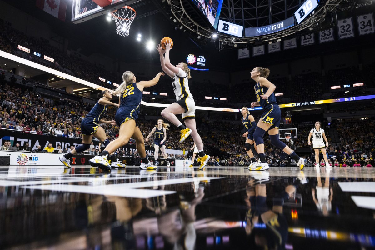 Iowa center Addison OGrady goes up for a shot during a basketball game between No. 2 Iowa and No. 6 Michigan at the TIAA Big Ten Women’s Basketball Tournament at Target Center in Minneapolis, Minn., on Saturday, March 9, 2024. The Hawkeyes defeated the Wolverines, 95-68.
