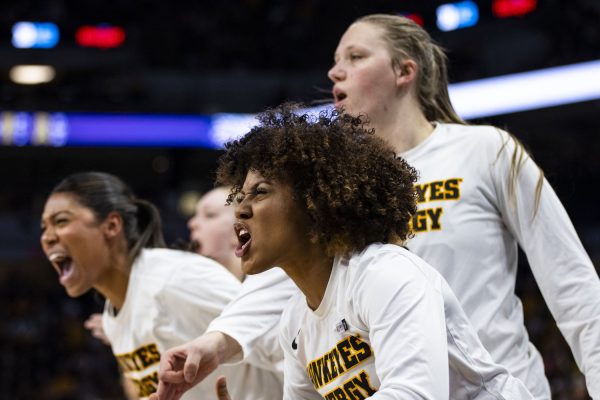 Iowa guard Kennise Johnson cheers during a basketball game between No. 2 Iowa and No. 5 Nebraska at the TIAA Big Ten Women’s Basketball Tournament at Target Center in Minneapolis, Minn., on Sunday, March 10, 2024. The Hawkeyes defeated the Corn Huskers in overtime, 94-89.