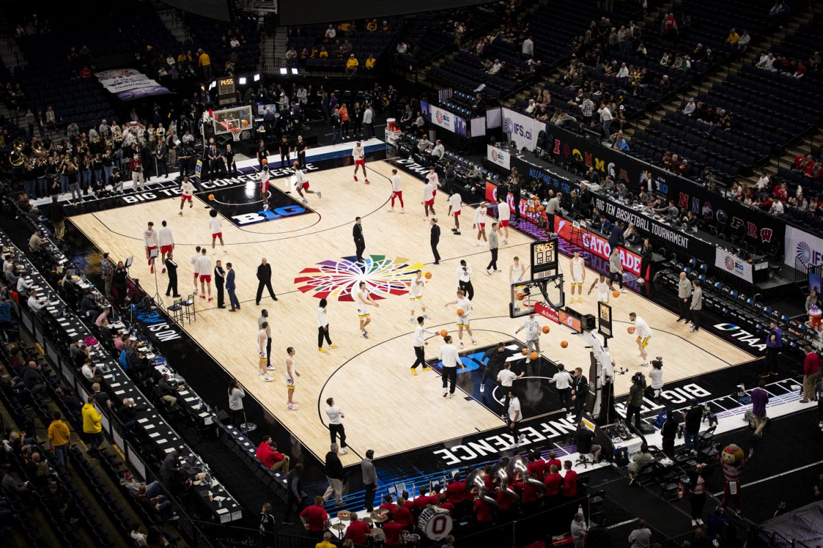 Iowa and Ohio State players warm up prior to a men’s basketball game between No. 7 Iowa and No. 10 Ohio State at the second round of the TIAA Big Ten Men’s Basketball Tournament at the Target Center in Minneapolis, Minn., on Thursday, March 14, 2024. The Buckeyes defeated the Hawkeyes, 90-78.
