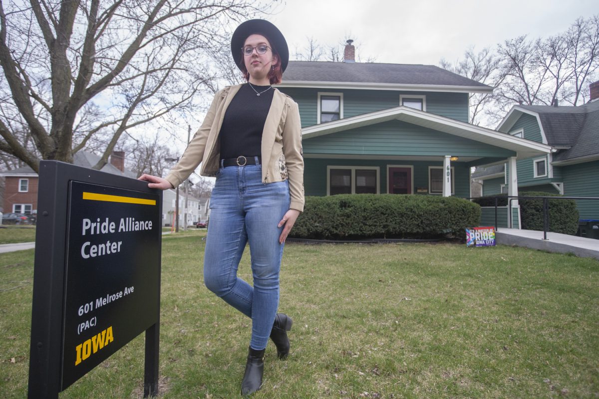 Kae Vdovichenko, head of the Queer Liberation Front, stands in front of the Pride Alliance Center in Iowa City on Sunday, March 17, 2024. DEI staff shortages would affect the UI Cultural Centers at the University of Iowa.