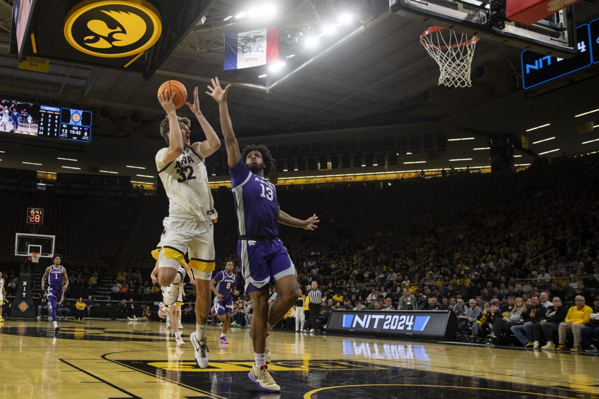 Iowa forward Owen Freeman goes up for a fade away layup during a men’s basketball game between Iowa and Kansas State at the first round of the National Invitation Tournament at Carver-Hawkeye Arena on Tuesday, March 19, 2024. The Hawkeyes defeated the Wildcats, 91-82. Freeman had 10 points and 6 rebounds. 