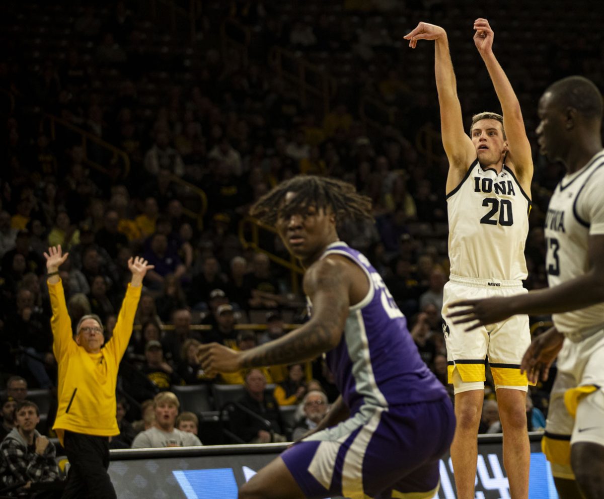 Iowa+forward+Payton+Sandfort+shoot+a+three+point+shot+during+a+men%E2%80%99s+basketball+game+between+Iowa+and+Kansas+State+at+the+first+round+of+the+National+Invitation+Tournament+at+Carver-Hawkeye+Arena+on+Tuesday%2C+March+19%2C+2024.+The+Hawkeyes+defeated+the+Wildcats%2C+91-82.+Sandford+was+50%25+from+the+three+point+line.+