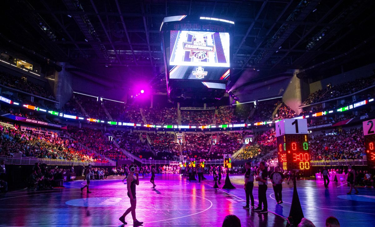 Wreslters prepare to compete during the first session of the NCAA men’s wrestling championships at T-Mobile Center in Kansas City, Missouri on Thursday March 21, 2024