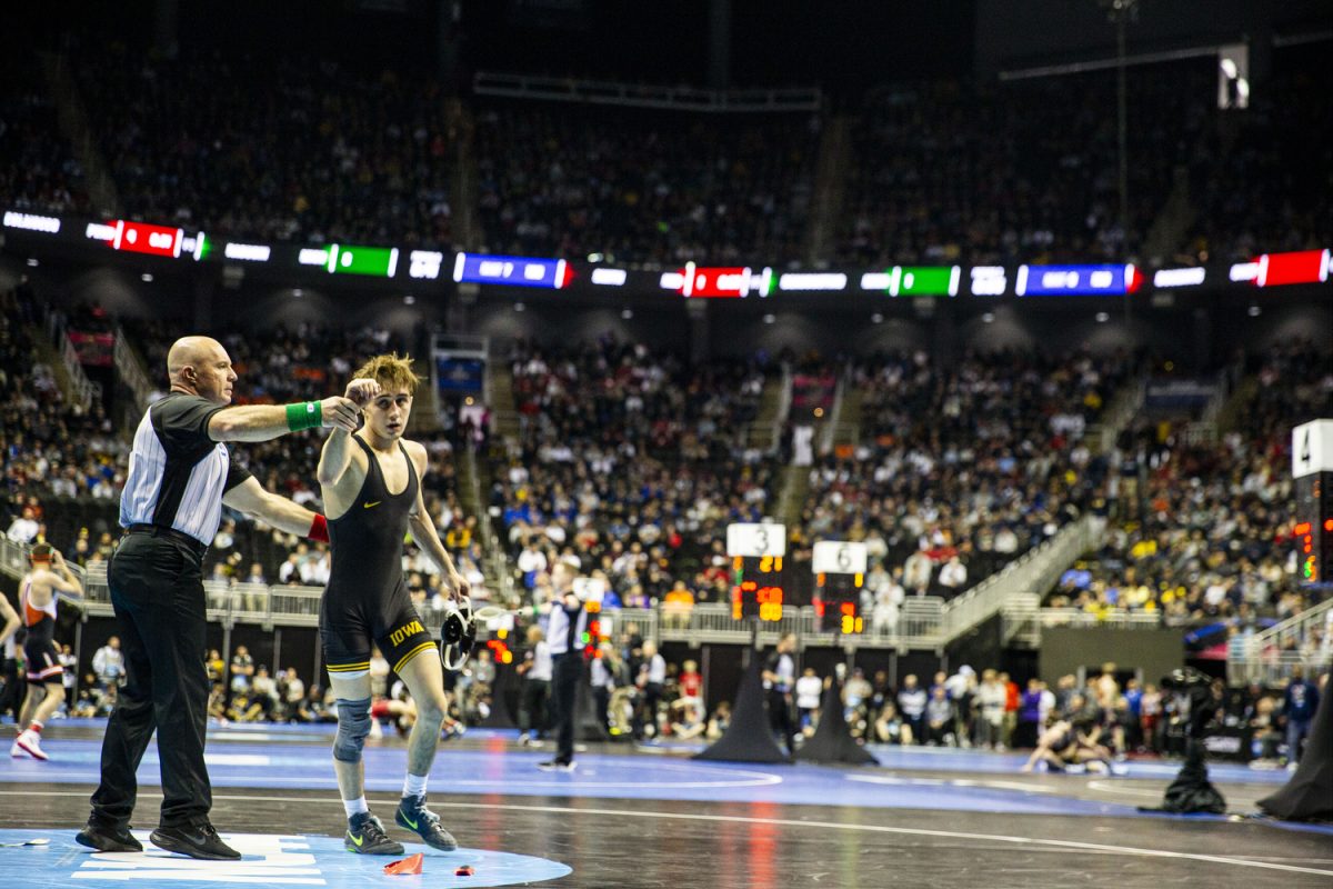 Iowas 125-pound Drake Ayala exits the mat after defeating No. 30 Elijah Griffin of Cal Baptist during the first session of the NCAA Men’s Wrestling Championships at the T-Mobile Center in Kansas City, Missouri, on Thursday, March 21, 2024.