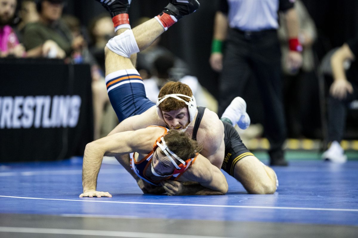 Iowa 165-pound Mike Caliendo wrestles Bucknell University  Noah Mulvaneyduring the second session of the NCAA men’s wrestling championships at T-Mobile Center in Kansas City, Missouri, on Thursday, March 21, 2024 