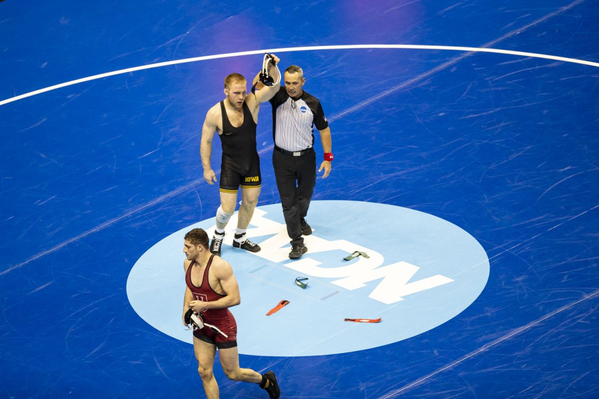 Campbell University 174-pound Austin Murphy walks off the mat after being defeated by Iowa Patrick Kennedy during the second session of the NCAA men’s wrestling championships at T-Mobile Center in Kansas City, Missouri, on Thursday, March 21, 2024.