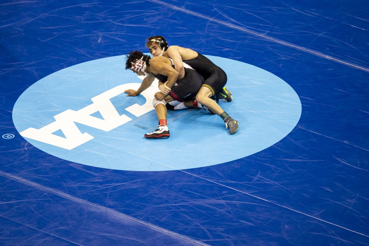 Iowa 125-pound Drake Ayala wrestles Stanford Nico Provo during the second session of the NCAA men’s wrestling championships at T-Mobile Center in Kansas City, Missouri, on Thursday, March 21, 2024 