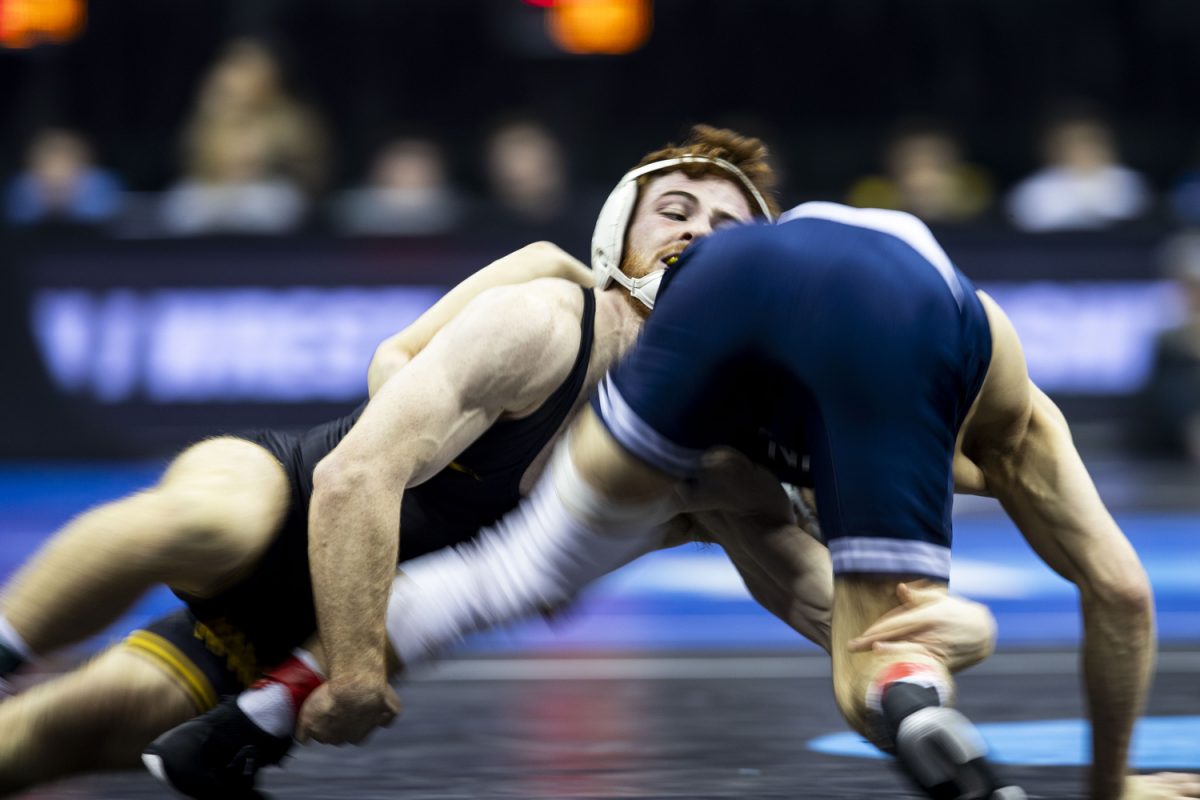 Penn State 165-pound Mitchell Mesenbrink wrestles Iowa Mike Caliendo during the fourth session of the NCAA men’s wrestling championships at T-Mobile Center in Kansas City, Missouri, on Friday, March 22, 2024. Mesenbrink won by major decision, 17-9.