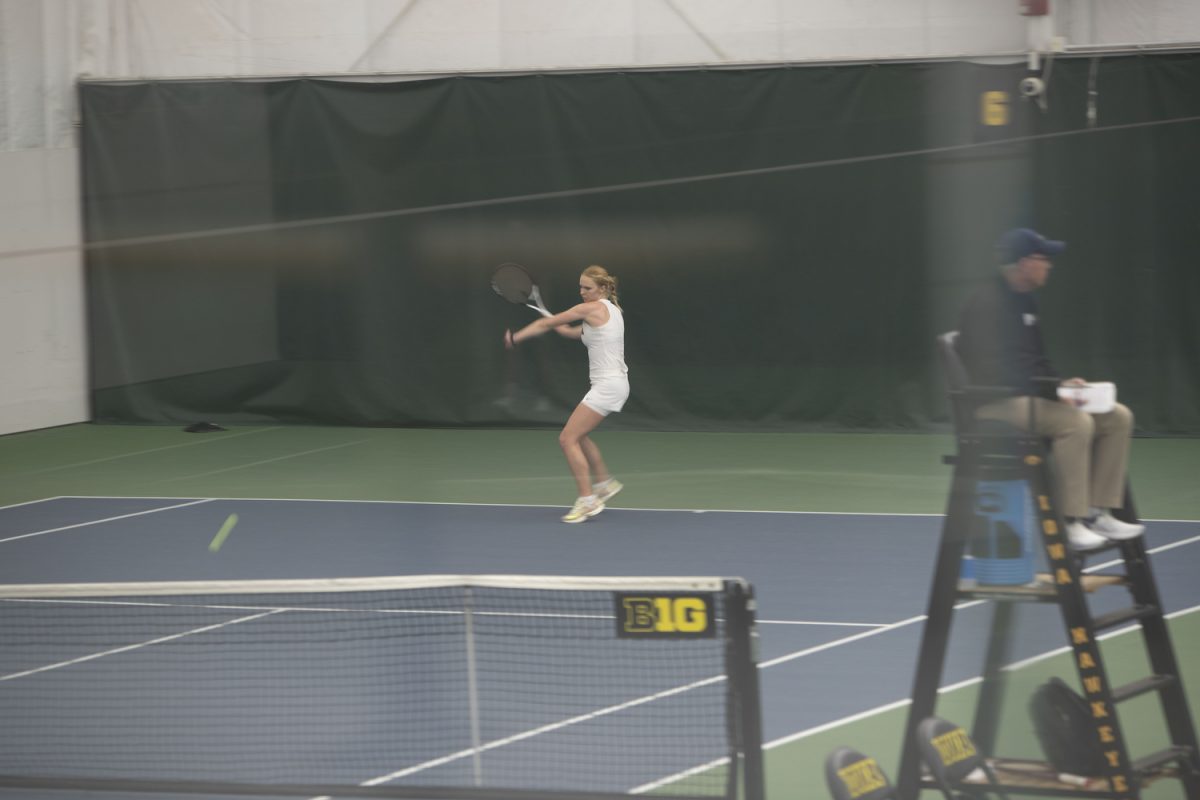 Iowa’s Jessica Matthews prepares to hit the ball during a tennis meet between Iowa and Illinois at the Hawkeye Tennis and Recreation Complex in Iowa City on Friday, March 22, 2024. The Hawkeyes defeated the Fighting Illini 4-2.