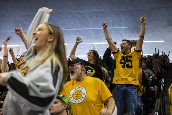 Fans cheer during an NCAA Tournament First Round game between No. 1 Iowa and No. 16 Holy Cross at Carver-Hawkeye Arena in Iowa City on Saturday, March 23, 2024. The Hawkeyes defeated the Crusaders, 91-65.