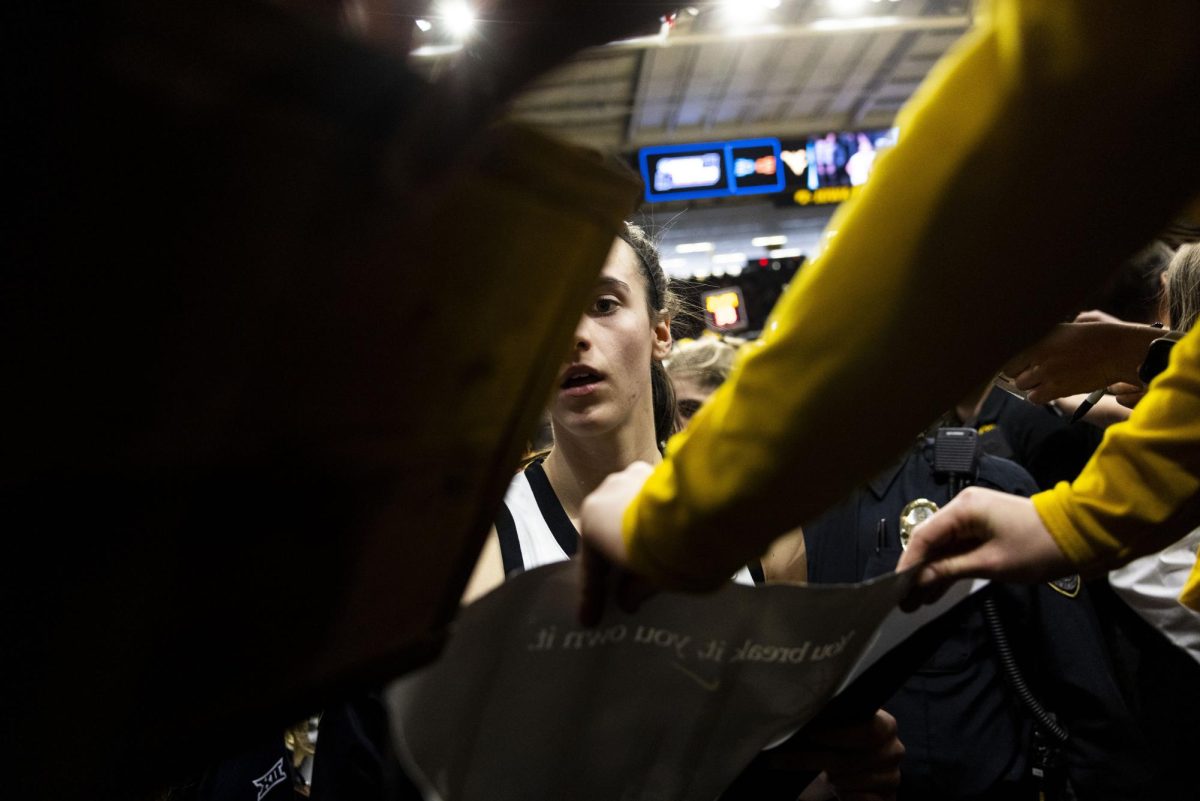 Iowa guard Caitlin Clark signs autographs after an NCAA Tournament First Round game between No. 1 Iowa and No. 16 Holy Cross at Carver-Hawkeye Arena in Iowa City on Saturday, March 23, 2024. The Hawkeyes defeated the Crusaders, 91-65.