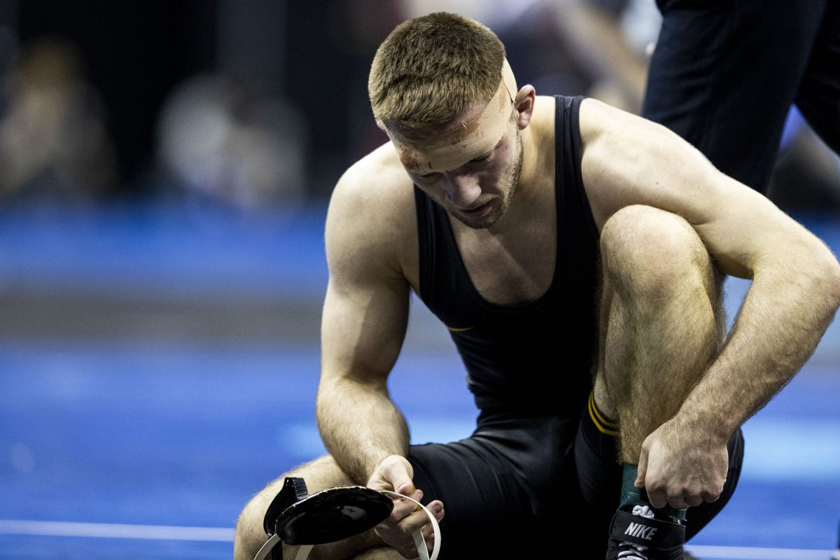 Iowa 157-pound Jared Franek prepares to get up after wrestling Nebraska Peyton Robb during the fifth session of the NCAA men’s wrestling championships at T-Mobile Center in Kansas City, Missouri, on Saturday, March 23, 2024. Robb won by major decision, 11-2 and placed seventh.