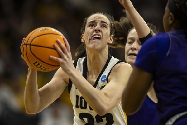 Iowa guard Caitlin Clark goes in for a layup during an NCAA Tournament First Round game between No. 1 Iowa and No. 16 Holy Cross at Carver-Hawkeye Arena in Iowa City on Saturday, March 23, 2024. The Hawkeyes defeated the Crusaders, 91-65.