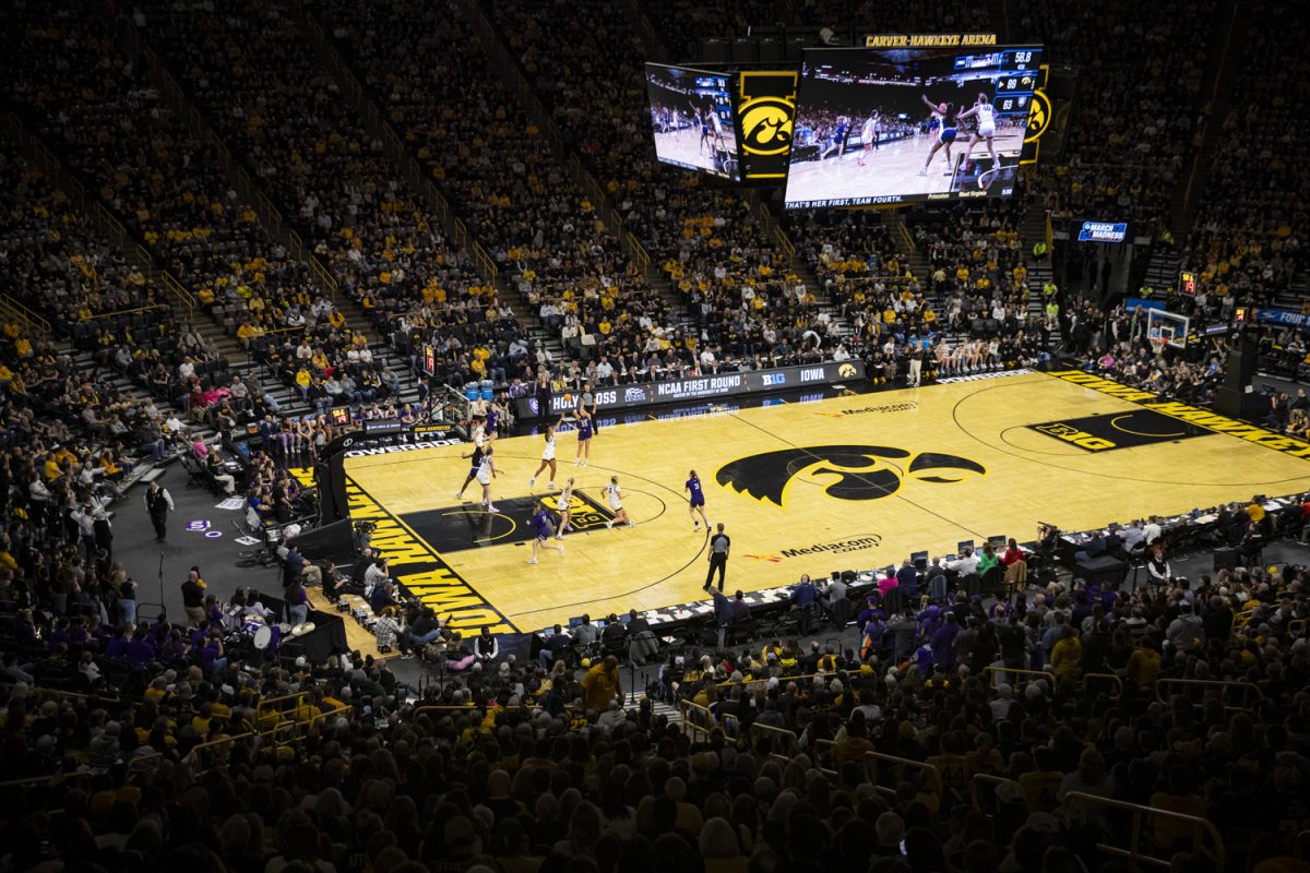 Holy Cross guard Mary-Elizabeth Donnelly shoots the ball during an NCAA Tournament First Round game between No. 1 Iowa and No. 16 Holy Cross at Carver-Hawkeye Arena in Iowa City on Saturday, March 23, 2024. The Hawkeyes defeated the Crusaders, 91-65.