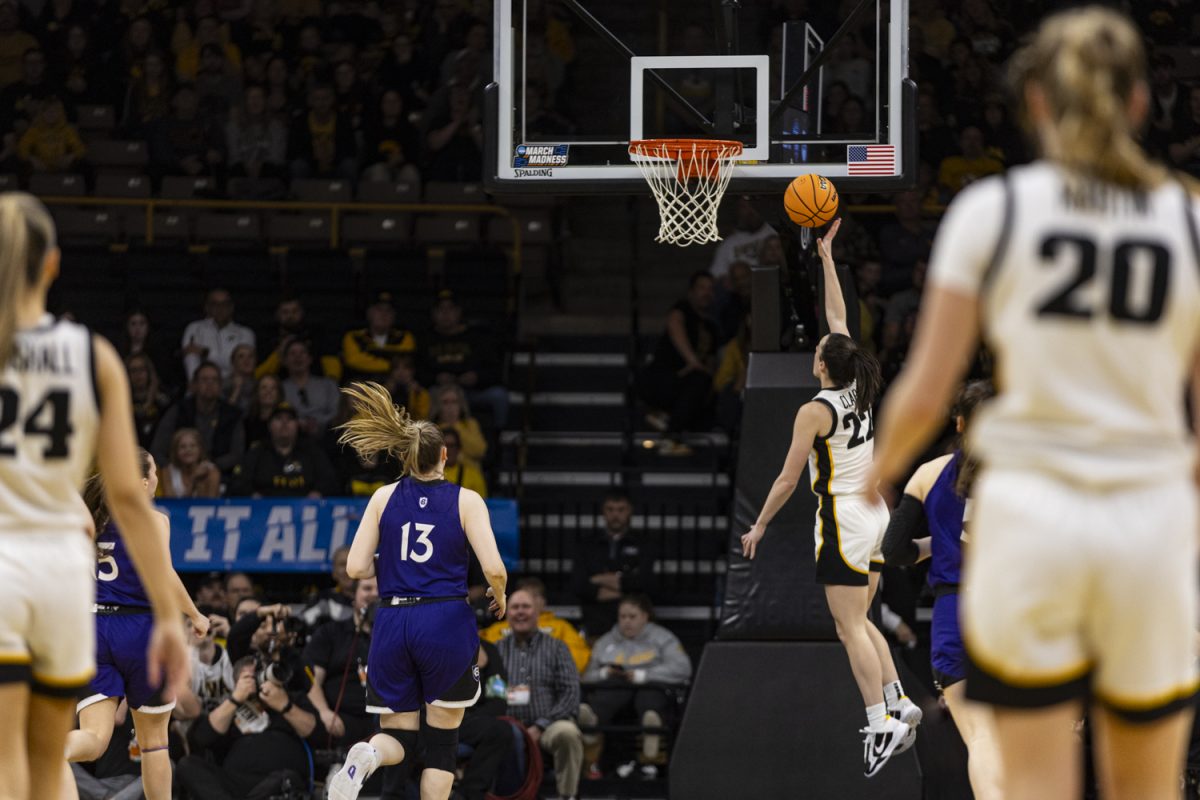 Iowa guard Caitlin Clark goes in for a layup during an NCAA Tournament First Round game between No. 1 Iowa and No. 16 Holy Cross at Carver-Hawkeye Arena in Iowa City on Saturday, March 23, 2024. The Hawkeyes defeated the Crusaders, 91-65.