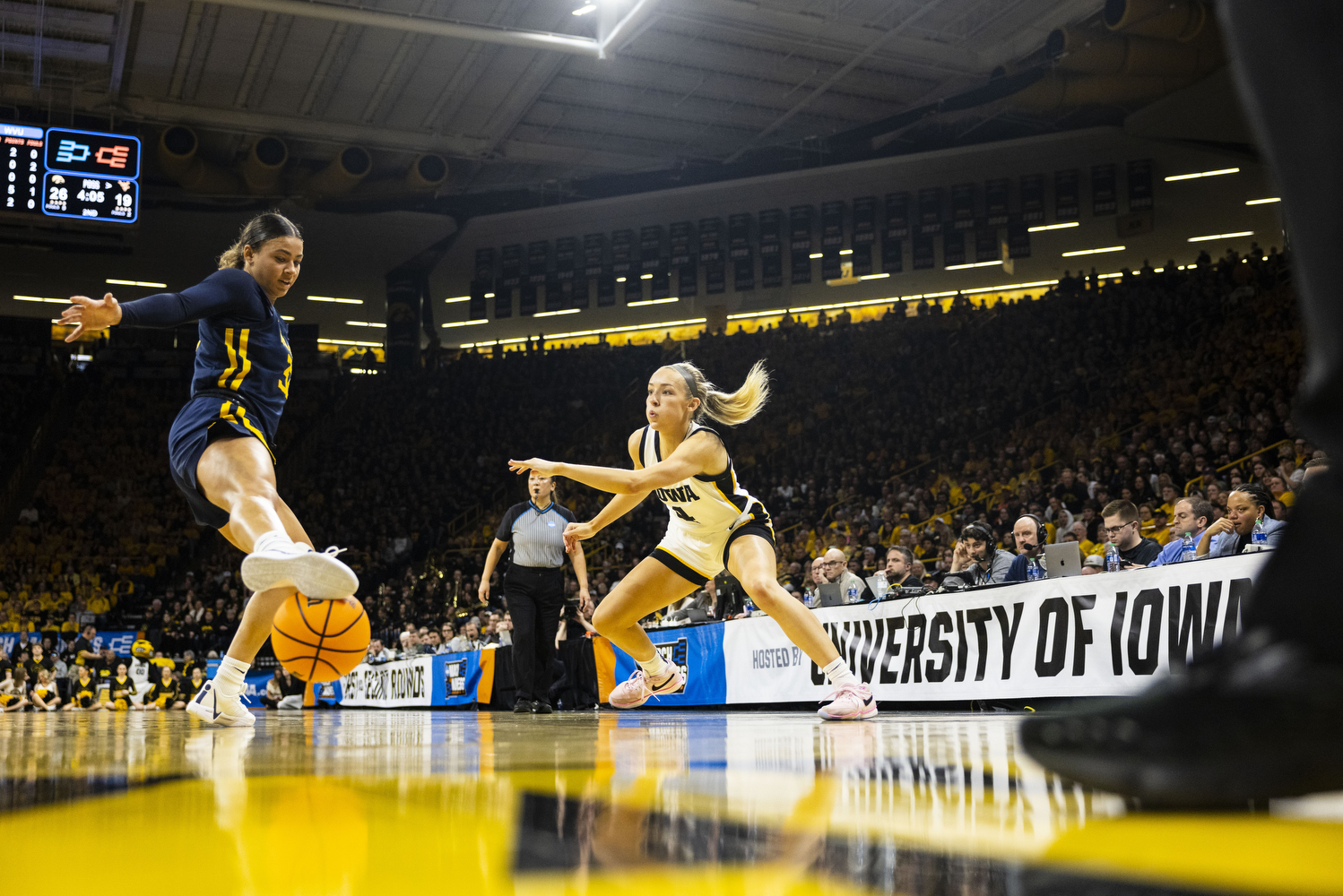 Iowa guard Kylie Feuerbach passes the ball during an NCAA Tournament Second Round game between No. 1 Iowa and No. 8 West Virginia at Carver-Hawkeye Arena in Iowa City on Sunday, March 24, 2024. The Hawkeyes defeated the Mountaineers, 64-54. (Grace Smith/The Daily Iowan)