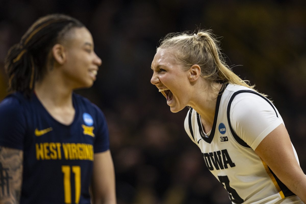 Iowa guard Sydney Affolter celebrates during an NCAA Tournament Second Round game between No. 1 Iowa and No. 8 West Virginia at Carver-Hawkeye Arena in Iowa City on Monday, March 25, 2024. The Hawkeyes defeated the Mountaineers, 64-54.