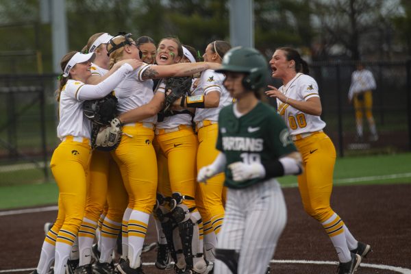 Iowa celebrates their win after a softball game between Iowa and Michigan State at Bob Pearl Field in Iowa City on Friday, March 29, 2024. The Hawkeyes defeated the Spartans 4-0. 