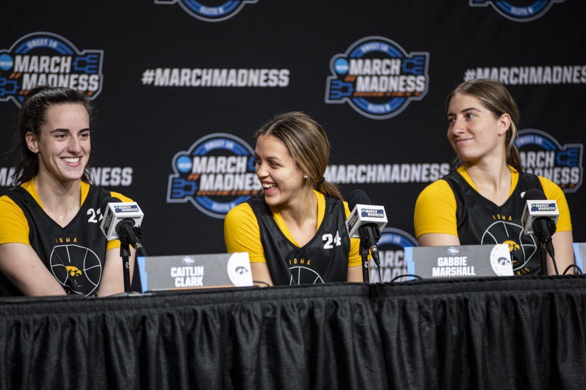 Iowa guard Caitlin Clark, guard Gabbie Marshall, and guard Kate Martin smile during a day of press conferences and open practices ahead of an NCAA Tournament Sweet Sixteen game between No. 1 Iowa and No. 5 Colorado at MVP Arena in Albany, N.Y., on Friday, March 29, 2024. The Hawkeyes and the Buffaloes face off Saturday at 2:30 p.m. CT.
