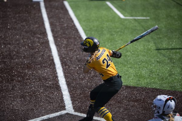 Iowa infielder Jena Young hits a ball in play during the first of two softball games between Iowa and Michigan State at Bob Pearl Field on Saturday, March 30, 2024. The Spartans defeated the Hawkeyes 8-2.