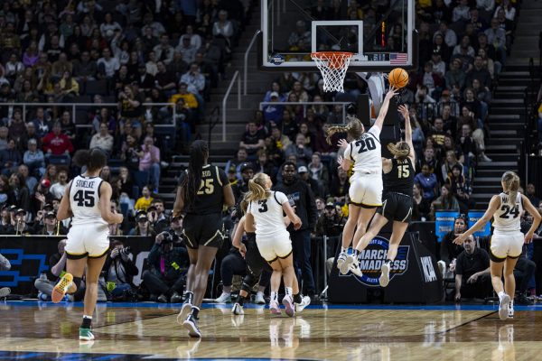 Iowa guard Kate Martin blocks Colorado guard Kindyll Wetta’s shot during a NCAA Tournament Sweet Sixteen game between No. 1 Iowa and No. 5 Colorado at MVP Arena in Albany, N.Y., on Saturday, March 30, 2024. (Ayrton Breckenridge/The Daily Iowan)