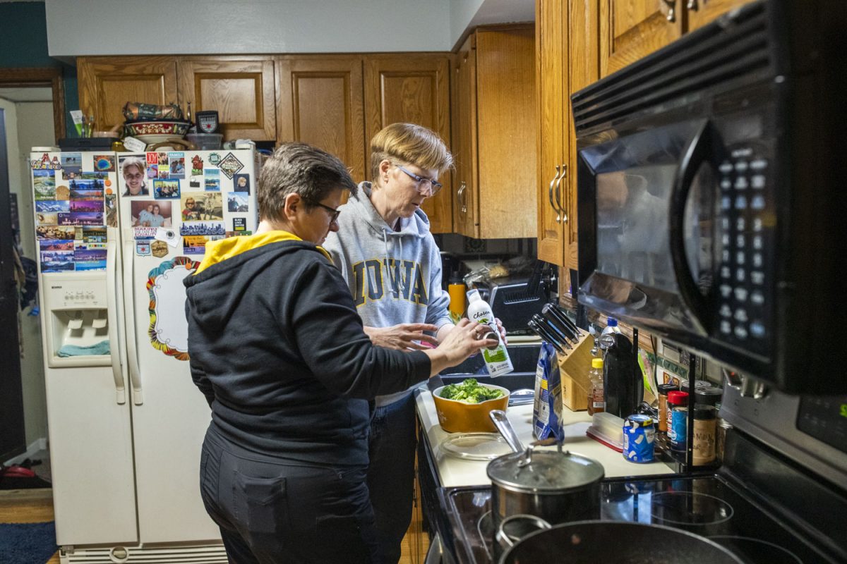 Jen and Dawn BarbouRoske make dinner at their home in Iowa City on Monday, April 1, 2024. The two were legally married July 12, 2009, after Iowa legalized same-sex marriage. Previously they had a wedding ceremony on Oct. 12, 1990.