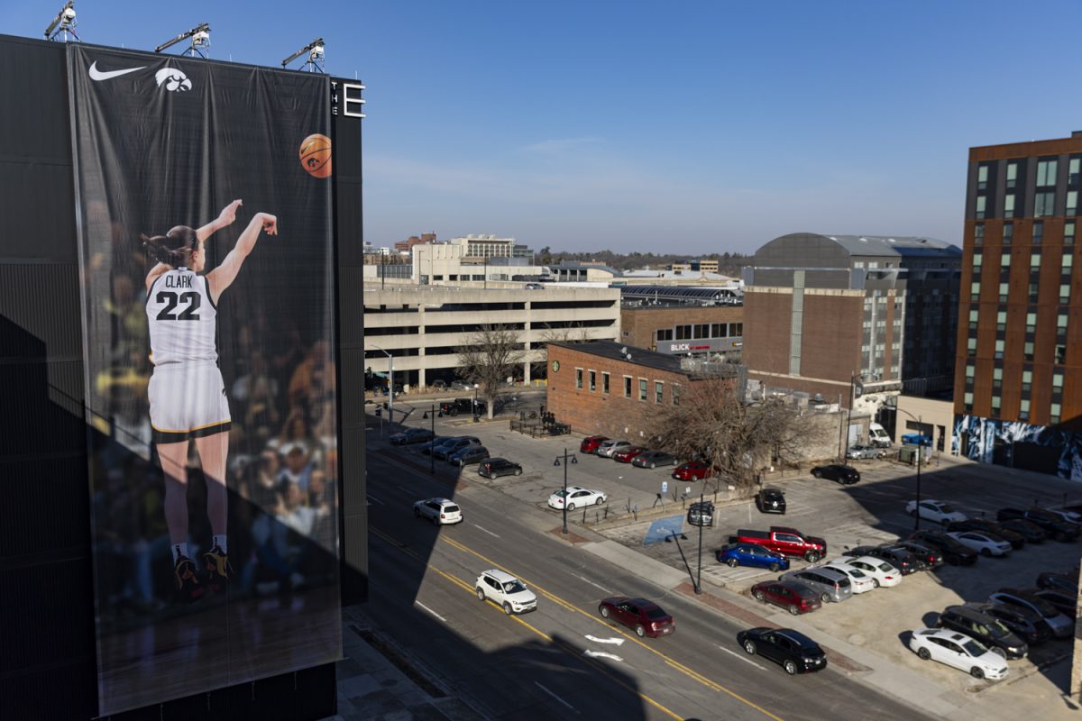 A+Nike+advertisement+of+Iowa+guard+Caitlin+Clark+is+seen+on+The+Edge+building+on+East+Burlington+Street+in+downtown+Iowa+City+on+Saturday%2C+March+2%2C+2024.+The+poster+was+put+up+in+the+early+morning.+%28Ayrton+Breckenridge%2FThe+Daily+Iowan%29