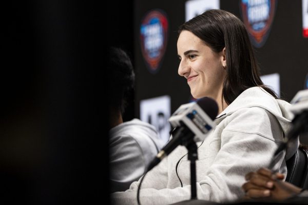 Iowa guard Caitlin Clark smiles during the 2024 Associated Press Coach and Player of the Year News Conference at Rocket Mortgage Field House in Cleveland, Ohio, on Thursday, April 4, 2024. 