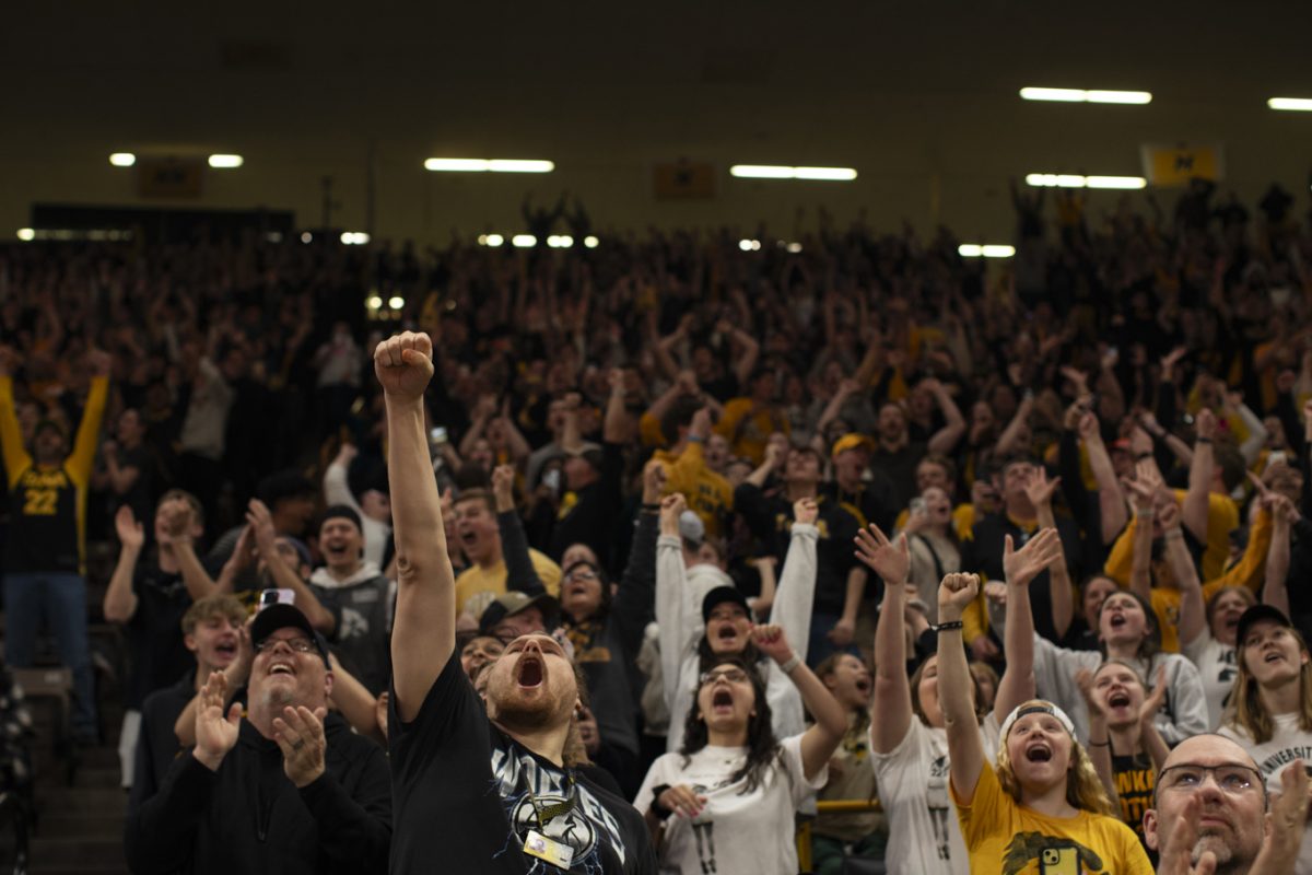 Fans celebrate the win during the women’s basketball Final Four watch party inside Carver-Hawkeye Arena in Iowa City on Friday, April 5, 2024.