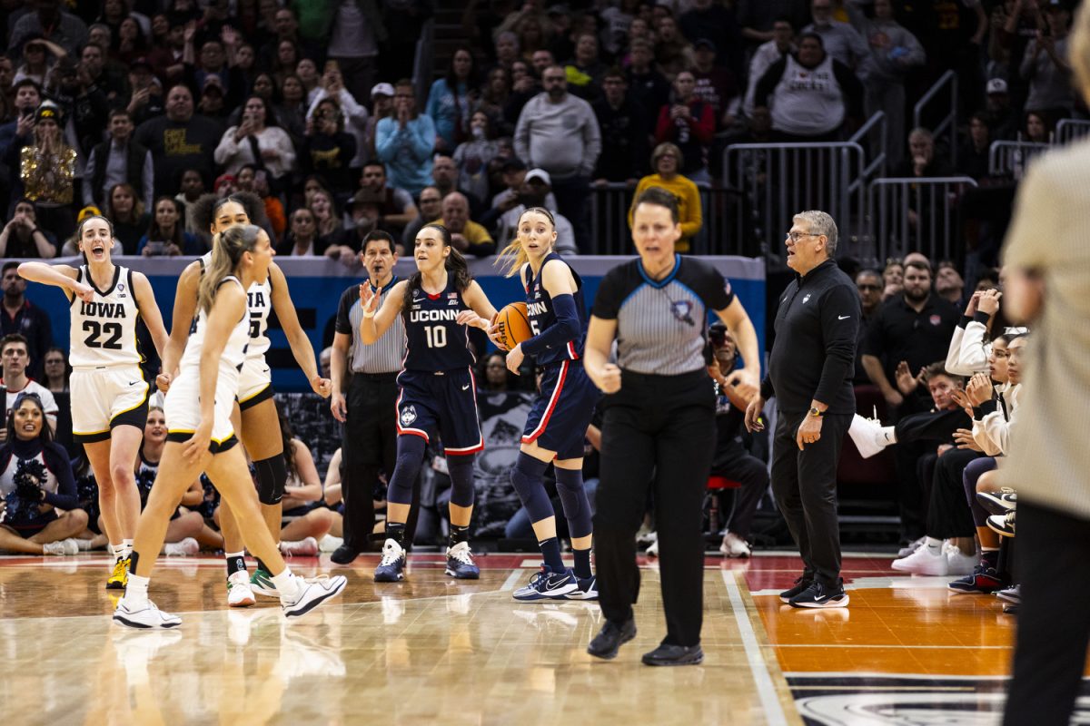 Iowa and UConn react to a foul call during a NCAA Tournament Final Four game between No. 1 Iowa and No. 3 UConn at Rocket Mortgage FieldHouse in Cleveland, Ohio, on Friday, April 5, 2024. The Hawkeyes defeated the Huskies, 71-69. 
