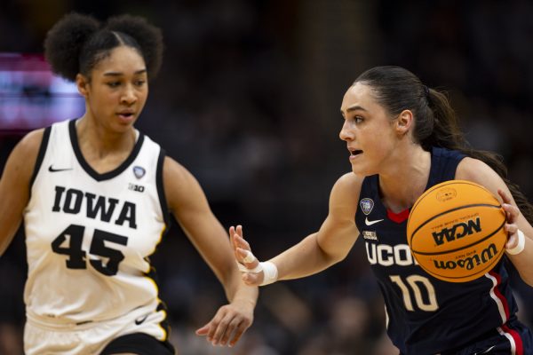 UConn guard Nika Mühl dribbles the ball during a NCAA Tournament Final Four game between No. 1 Iowa and No. 3 UConn at Rocket Mortgage FieldHouse in Cleveland, Ohio, on Friday, April 5, 2024. The Hawkeyes defeated the Huskies, 71-69.