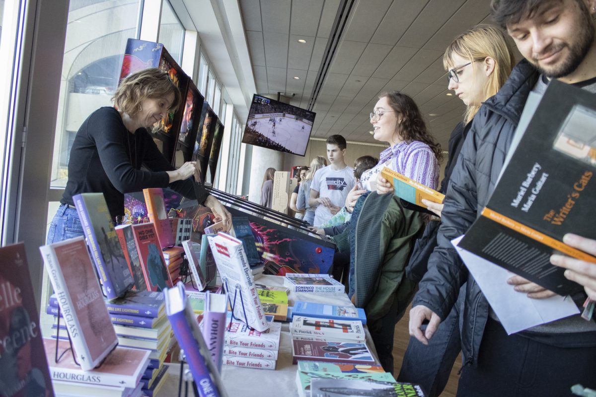 Small presses work a stand at SpareMe bowling alley in the Chauncey during a book fair for the Mission Creek festival on Saturday, April 6, 2024.