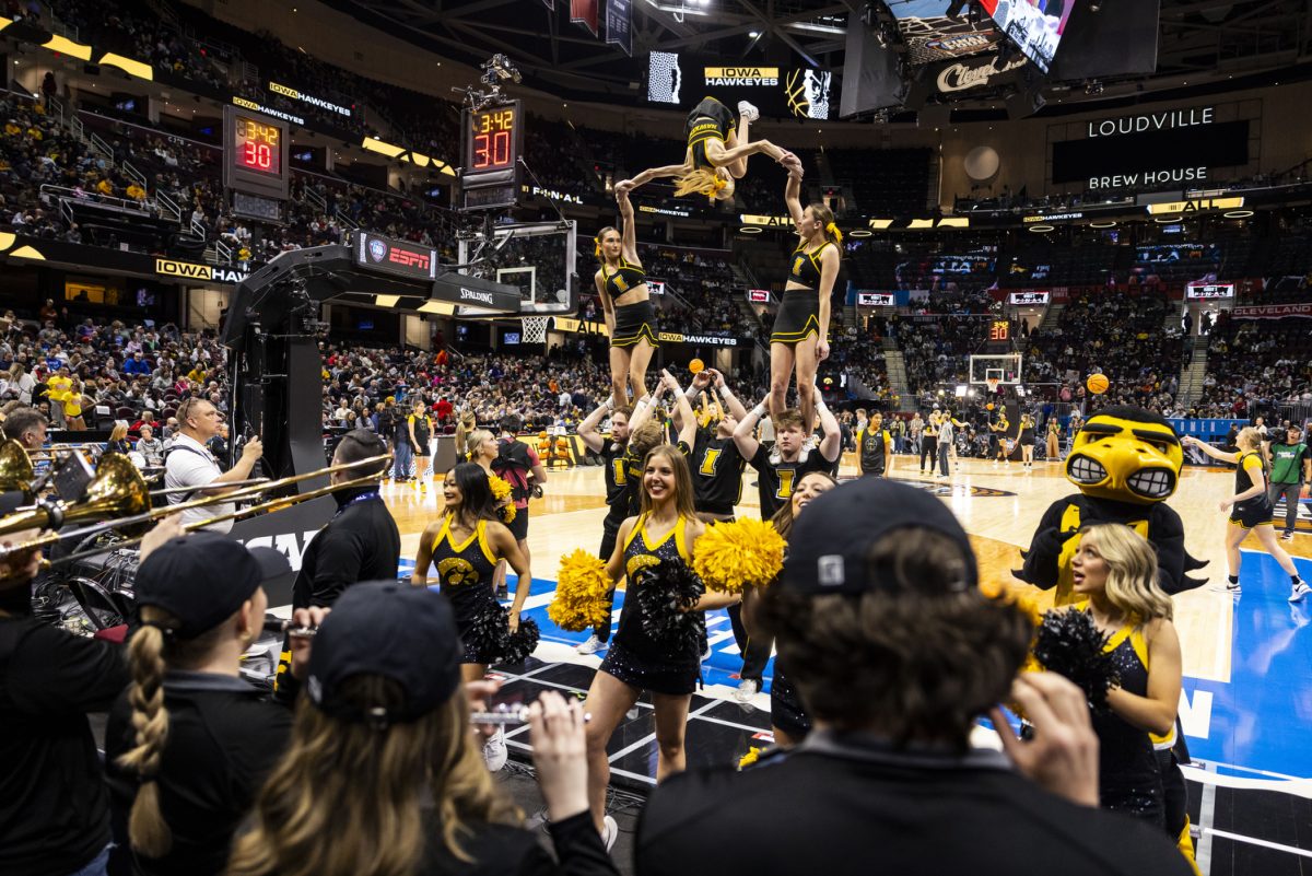 Members+of+the+Hawkeye+Pep+Band+and+the+Iowa+Spirit+Squad+perform+during+a+day+of+press+conferences+and+open+practices+ahead+of+a+NCAA+Championship+game+between+No.+1+Iowa+and+No.+1+South+Carolina+at+Rocket+Mortgage+FieldHouse+in+Cleveland%2C+Ohio%2C+on+Saturday%2C+April+6%2C+2024.+The+Hawkeyes+and+the+Gamecocks+face+off+at+2%3A00+p.m.+CT.