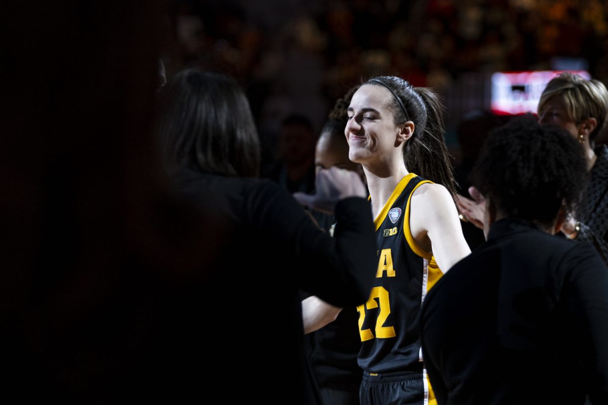 Iowa guard Caitlin Clark walks onto the court during a NCAA Championship game between No. 1 Iowa and No. 1 South Carolina at Rocket Mortgage FieldHouse in Cleveland, Ohio, on Sunday, April 7, 2024. (Ayrton Breckenridge/The Daily Iowan)