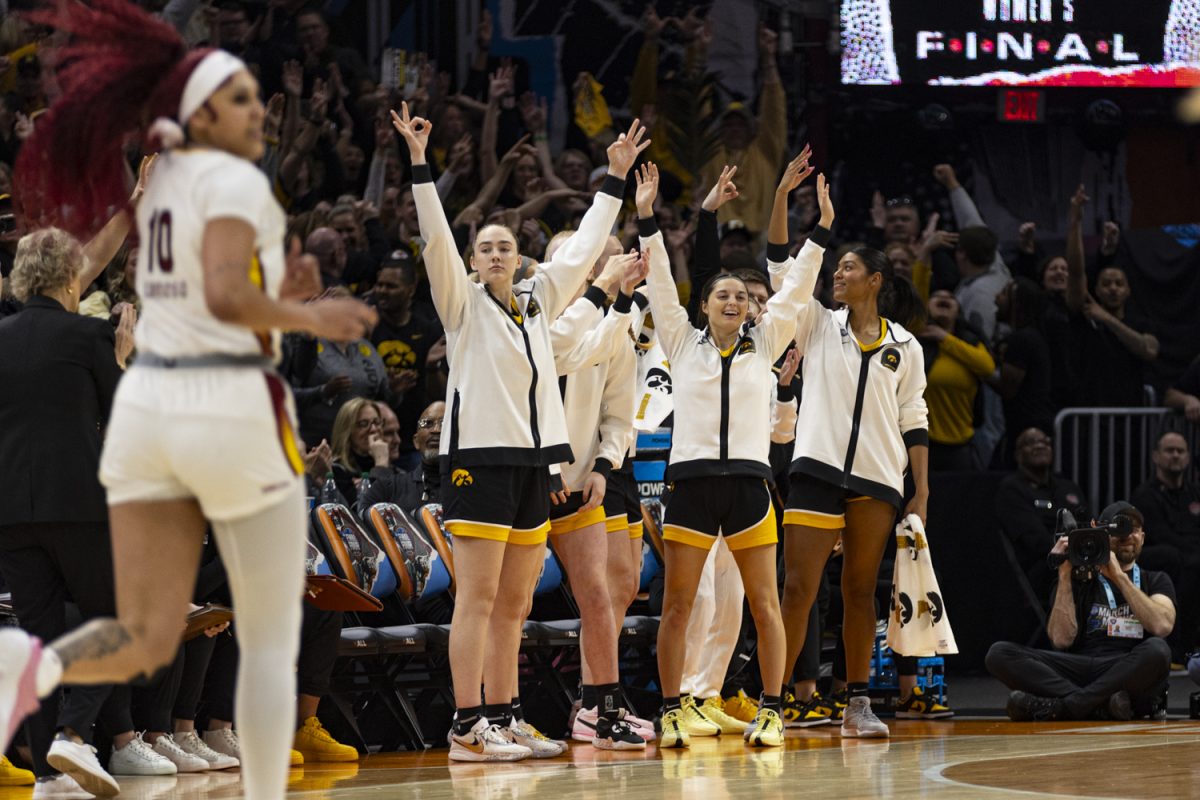 Members of the Iowa women’s basketball team celebrate during a NCAA Championship game between No. 1 Iowa and No. 1 South Carolina at Rocket Mortgage FieldHouse in Cleveland, Ohio, on Sunday, April 7, 2024. (Ayrton Breckenridge/The Daily Iowan)